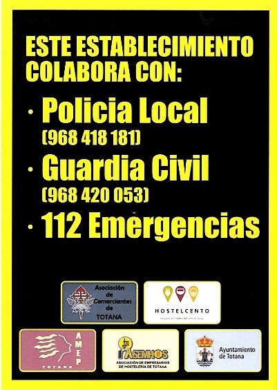 Los comercios y establecimientos hosteleros distribuirán adhesivos con los números de teléfonos de los cuerpos y fuerzas de seguridad y emergencias
