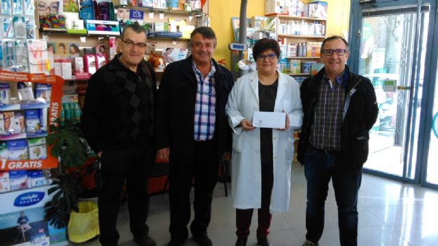  Cáritas -  Iglesia de Santiago el Mayor / Farmacia Ldo. Martínez Serrano